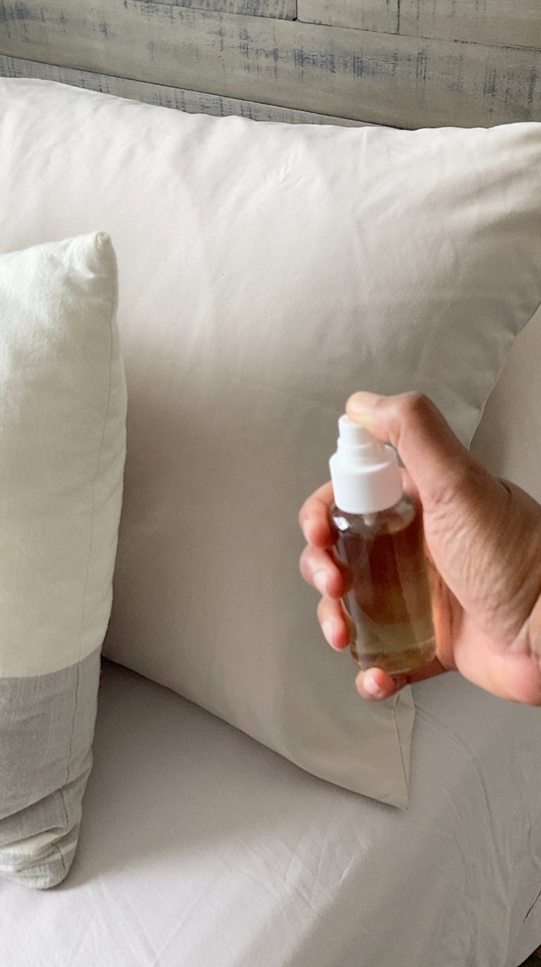 Spray bottle of lavender linen spray with dried lavender buds