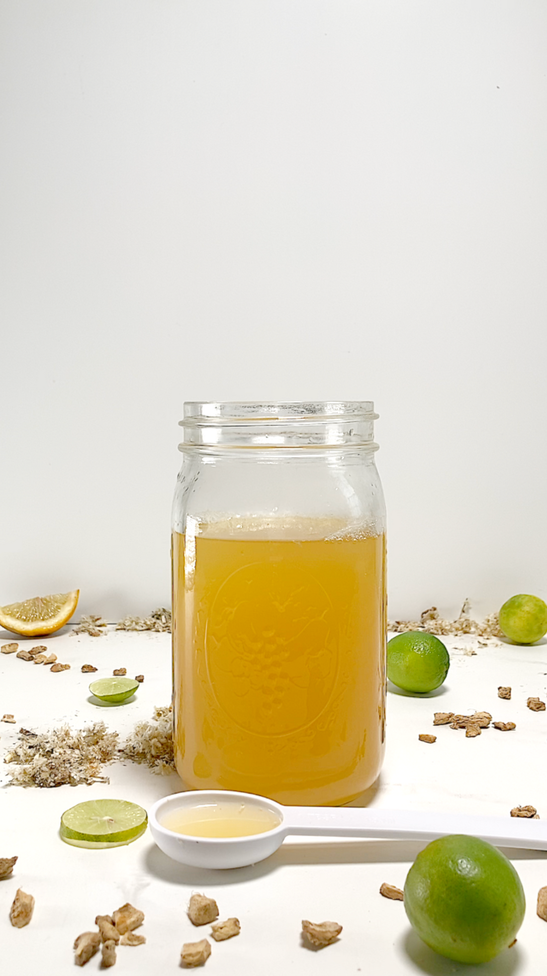 Mug of mullein and ginger tea with fresh citrus slices