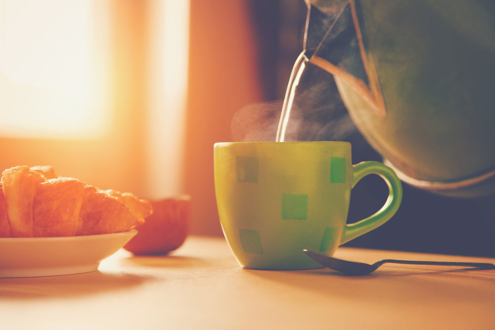A mug of herbal tea by a sunlit window