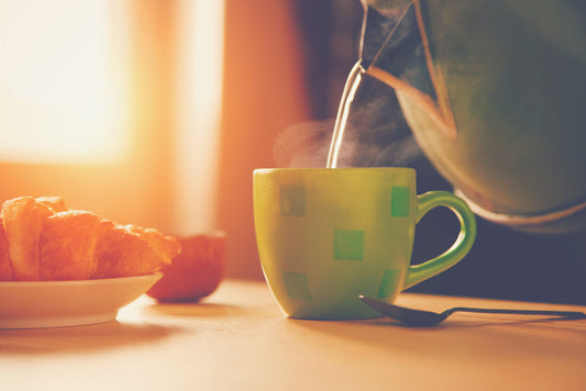 A mug of herbal tea by a sunlit window