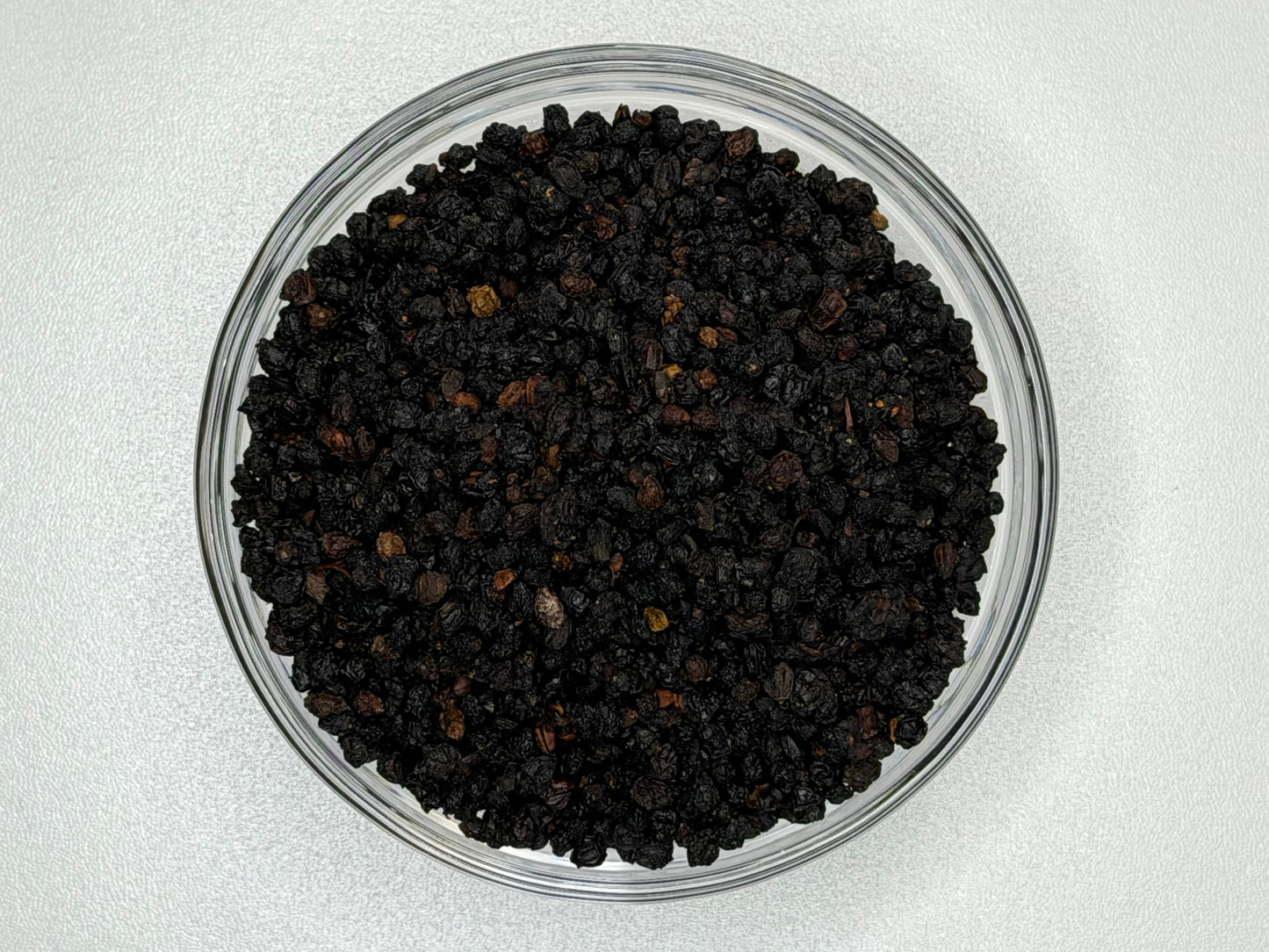 Whole dried elderberries in a bowl
