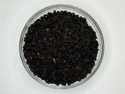 Whole dried elderberries in a bowl